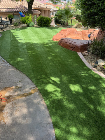A full backyard artificial grass refresh done by pure desert pool co in Ivins, Utah.